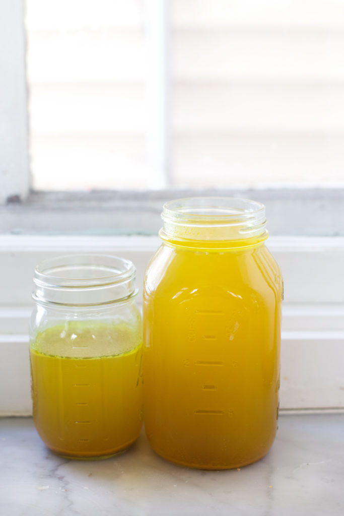 Jars of fresh bone broth for risotto 